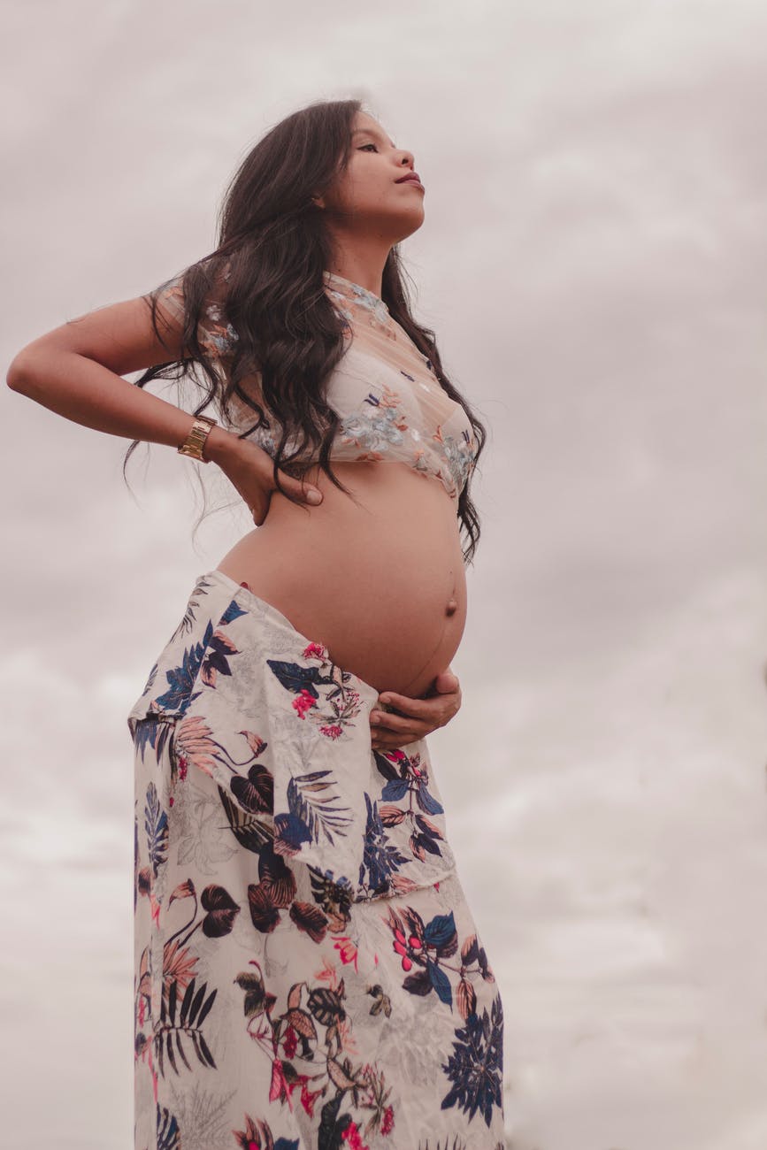 pregnant woman wearing crop top